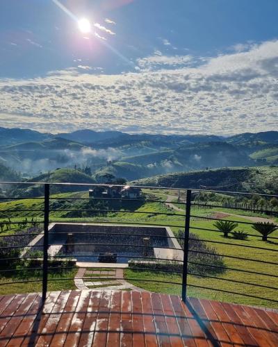 a view of the mountains from a balcony at Lavandas de Cunha Pousada Boutique in Cunha
