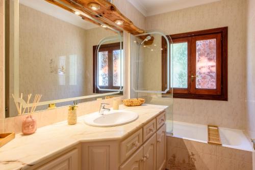 a bathroom with a sink and a mirror at Can Peppe in Sant Josep de Sa Talaia