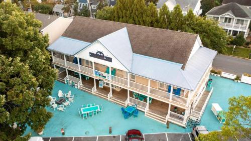 an aerial view of a large house with a swimming pool at Canalside Inn in Rehoboth Beach