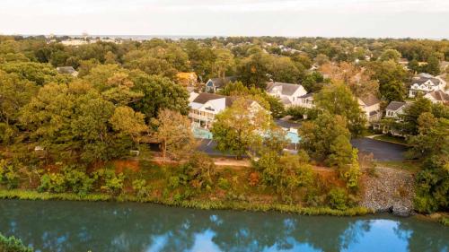 an aerial view of a house next to a river at Canalside Inn in Rehoboth Beach