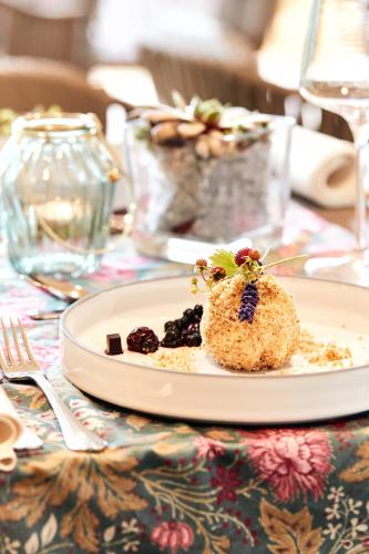 a plate of food sitting on a table at Ferienhotel Jörglerhof in Hainzenberg