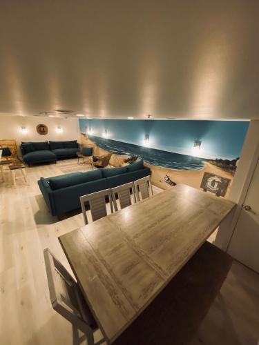 a living room with a table and a couch at Canalside Inn in Rehoboth Beach