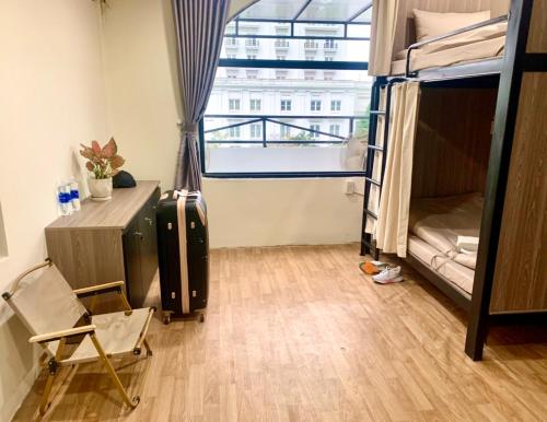 Postel nebo postele na pokoji v ubytování LaLa Homestay