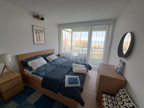 Posteľ alebo postele v izbe v ubytovaní Silver Coast Apartman