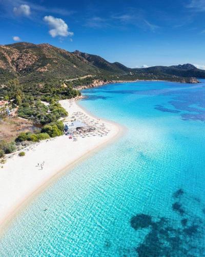 an aerial view of a beach in the ocean at Il Melograno casa vacanze in Teulada