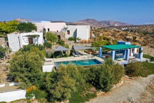 an aerial view of a house with a swimming pool at Loukoum Syros Cyclades in Rózia
