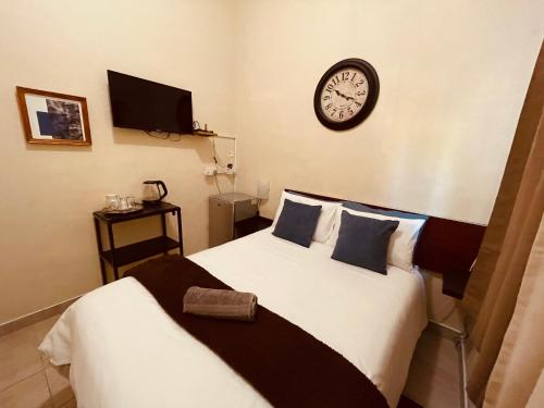 Ένα ή περισσότερα κρεβάτια σε δωμάτιο στο Abrama Bed And Breakfast