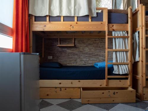 a bunk bed with a blue bed in a room at My Hostel in Dahab - Dive center in Dahab
