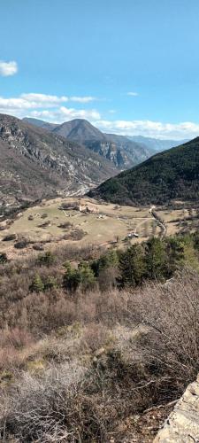 a view of a valley from the top of a mountain at Le panorama 