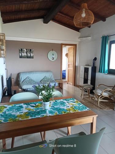 a living room with a table and a couch at Casale Bavi in Ortona