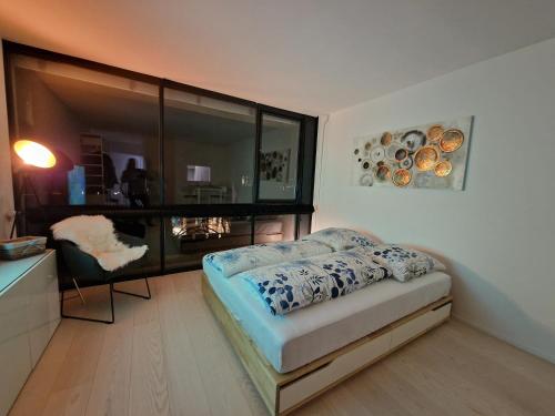 Postel nebo postele na pokoji v ubytování The Ultimate Studio Rhine View