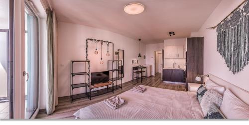 a bedroom with a bed and a sink in it at Waterfront Boutique Suite in Budapest