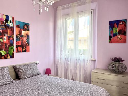 Ένα ή περισσότερα κρεβάτια σε δωμάτιο στο La Meria di Maria Casa Viola