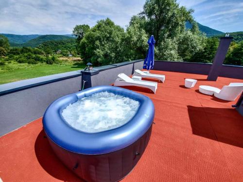a hot tub on the roof of a house at Lohovo Villa Bukva in Otoka