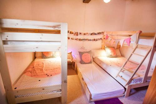 a room with three bunk beds in it at LA GRAN VÍA in Bocairent