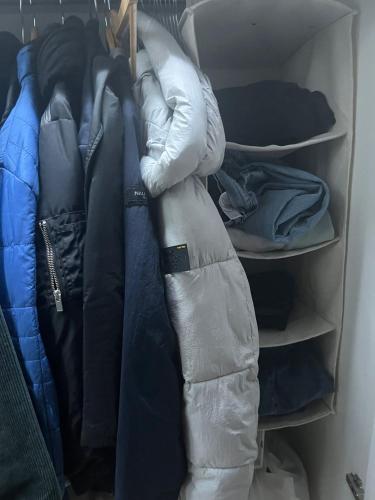 a sleeping bag is sitting on a closet shelf at The AA WIFI in London