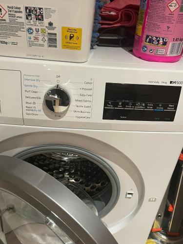 a washing machine on a shelf in a store at The AA WIFI in London