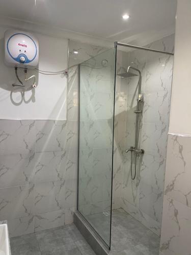 a shower in a bathroom with a glass shower stall at Mansal Luxury Apartments in Lagos