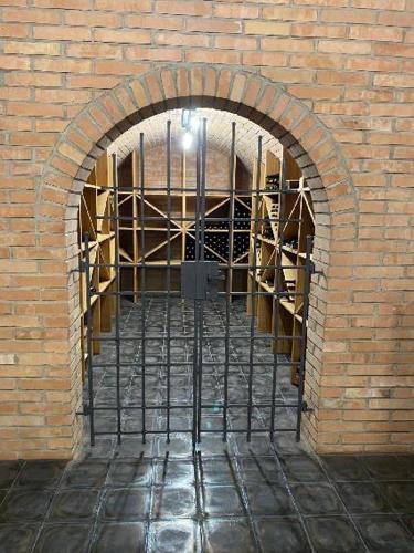 a brick wall with an archway in a building at Penzion Honzy in Bavory