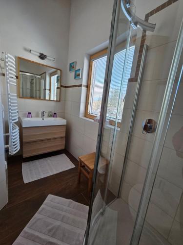 a bathroom with a sink and a shower at Chalet Steinernes Meer in Maria Alm am Steinernen Meer