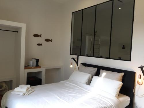 Katil atau katil-katil dalam bilik di Fra Cielo e Mare Boutique Rooms
