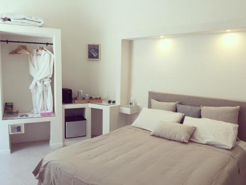 Katil atau katil-katil dalam bilik di Fra Cielo e Mare Boutique Rooms