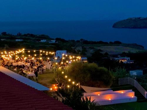 a party is set up at night with lights at Hotel Borgo Cacciatori in Ventotene