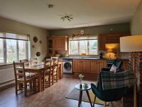 a kitchen with a table and chairs in a room at Lakeview Retreat 