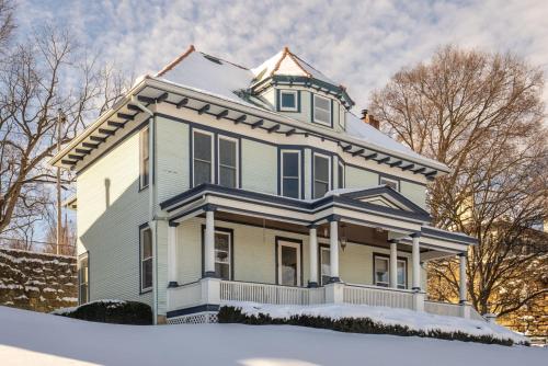 a blue and white house with snow on the ground at Dubuque's Front Porch, Historic Charmer, Walk Downtown in Dubuque