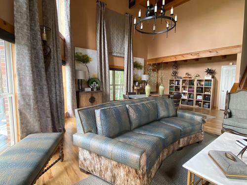 a living room with a couch and a table at Pointe View Lodge 