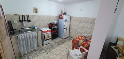 a kitchen with two refrigerators and a sink at Casa Caiçara Centro in Paraty