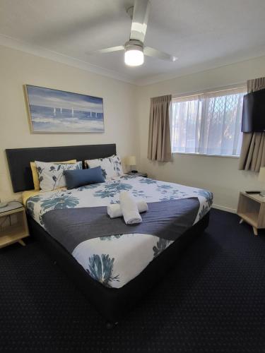 a bedroom with a large bed in a room at BEST Ground Floor pool side Superior apartment - new listing in Gold Coast