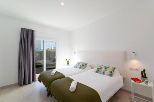 Postel nebo postele na pokoji v ubytování Villa Malvasia by Villa Plus
