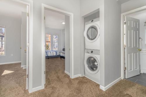 a laundry room with a washer and dryer at Downtown Views-Prime Location! in Cincinnati