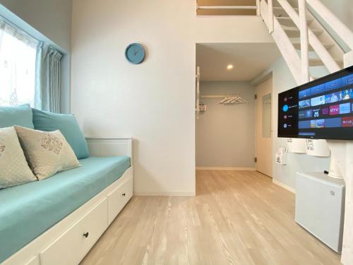 a room with a bed and a flat screen tv at K,K,House in Osaka - Vacation STAY 68932v in Osaka
