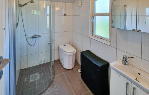 a bathroom with a shower and a toilet and a sink at 1 Bedroom Nice Home In Billdal in Särö