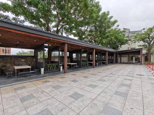 a building with a courtyard with tables and benches at Fantasy Palace in Yuchi