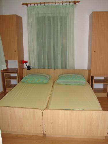 Tempat tidur dalam kamar di Apartments Boljat