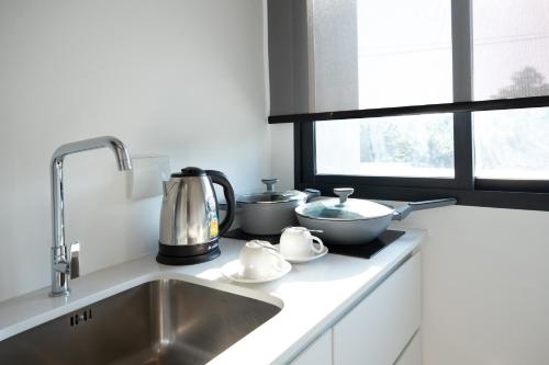 a kitchen counter with a sink and a mixer at Central Hill View A902 A in Kathu