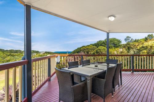 a patio with a table and chairs on a deck at Seas the day in Kilcunda