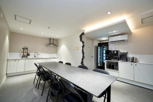 a kitchen and dining room with a table and chairs at Life in Euljiro in Seoul