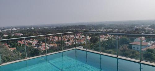 a swimming pool with a view of a city at Home Office,Whitefield, ITPL in Bangalore