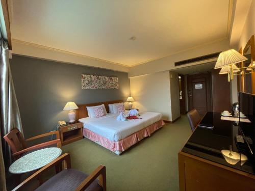 Ένα ή περισσότερα κρεβάτια σε δωμάτιο στο Songphanburi Hotel