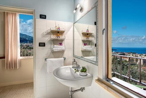 a bathroom with a sink and a window at Casa Nannina in Meta