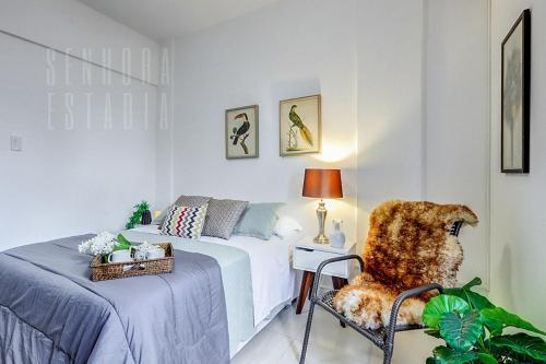 Ένα ή περισσότερα κρεβάτια σε δωμάτιο στο LUGA Excelente Apartamento WIFI 350mb no Centro