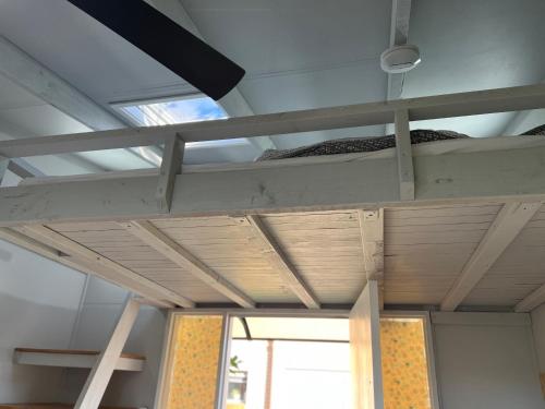 a room with two bunk beds and a window at XYL Holiday Inn in Caloundra