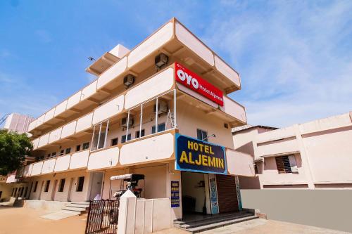 a building with a hotel alhamim sign on it at Hotel Aljemin in Kanyakumari