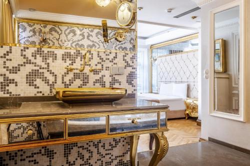 a bathroom with a sink on top of a counter at Superb Studio in Historic Mansion in Beylerbeyi in Istanbul