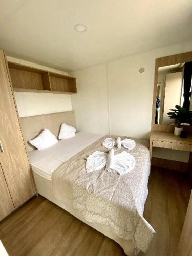 a bedroom with a bed with towels on it at TinyHausHotel Beilngries in Beilngries