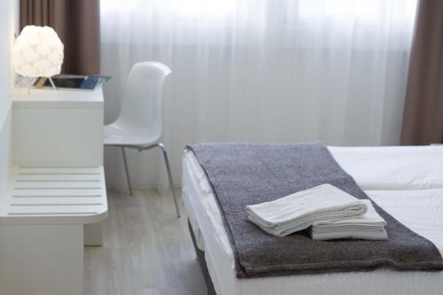 Una cama o camas en una habitación de Hotel Centrale